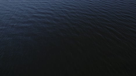 Aerial-shot-of-calm-waves-creating-textures-in-the-vast-ocean