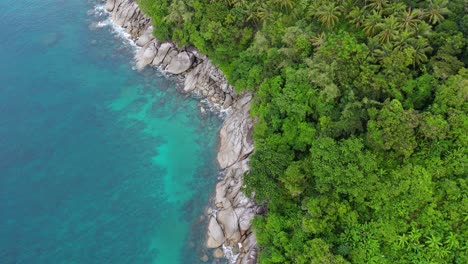 phuket island’s stone coast, green forests, and blue waters: a breathtaking 4k drone flight over tropical paradise