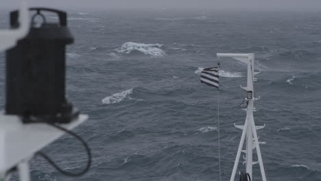 flag on the ship blowing in the storm