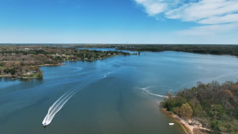 wake behind cruising boat in tranquil water of wye river in maryland, united states