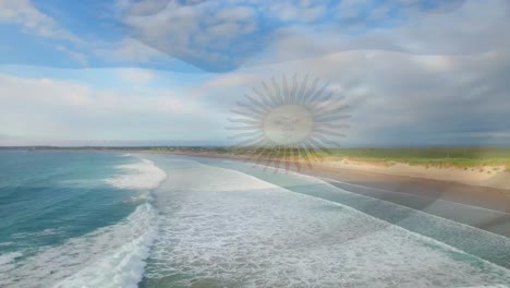 digital composition of waving argentina flag against aerial view of the beach and sea waves