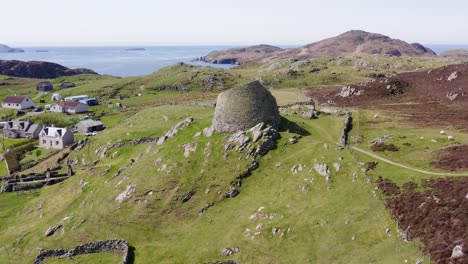 tilting drone shot of the 'dun carloway broch' on the west coast of the isle of lewis, part of the outer hebrides of scotland