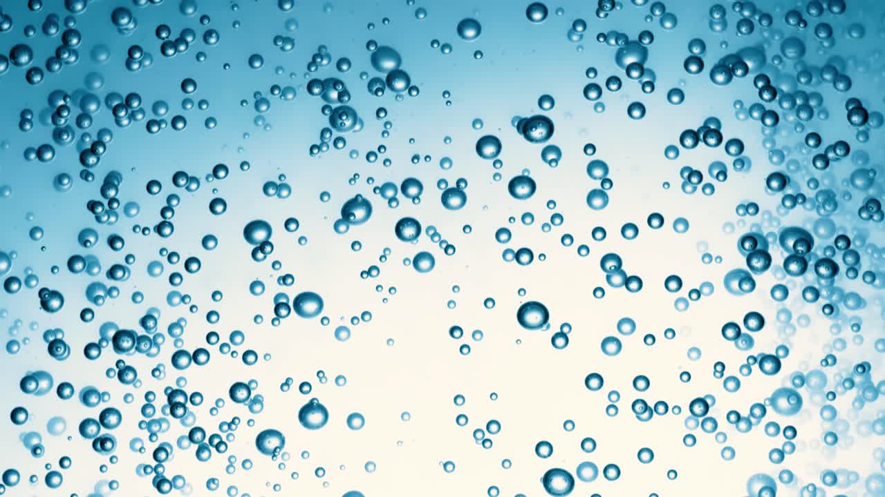 Many water bubbles in blue water close up, abstract water wave with bubbles in slow motion.
