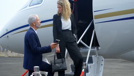 business people interacting with each other at the entrance of private jet 4k