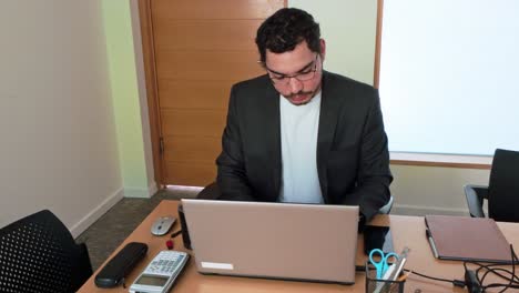 analyst researching on laptop