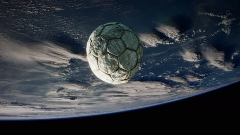 old soccer ball in space on earth orbit