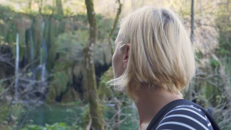 close up of a young blond woman enjoying the natural surroundings