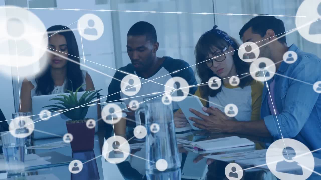 Animation of network of profile icons against diverse colleagues discussing at office
