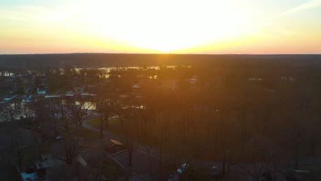 Beautiful-Sunrise-Over-Body-of-Water-Grand-Lake-O'-the-Cherokees-In-Midwest-Oklahoma-Looking-Over-Reservoir-and-Forest---aerial-drone-shot