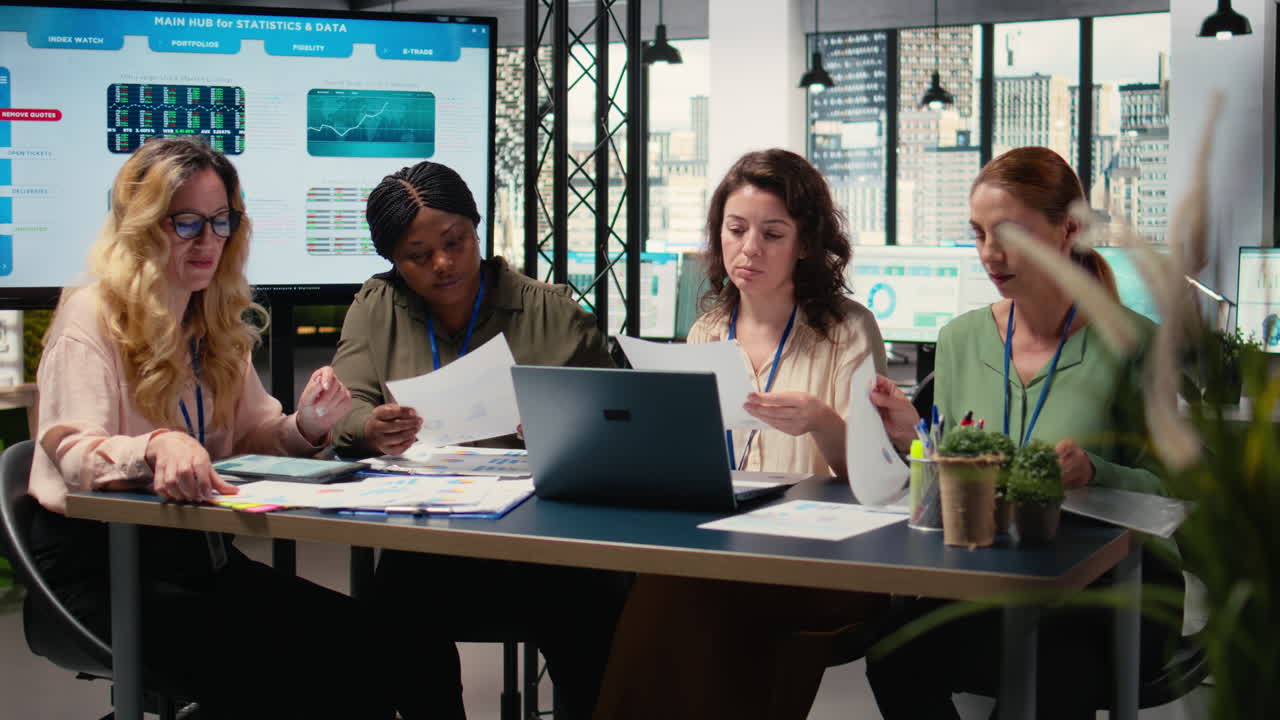 Vertical Video Multiethnic businesswomen group working on development plans