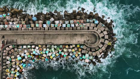 the drone is hovering topdown above the pier los cubos de la memoria in bilboa spain aerial footage 4k