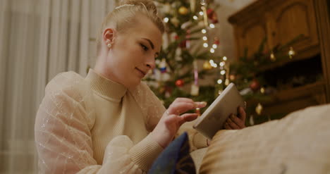 Woman-Using-Digital-Tablet-And-Shopping-Online-During-Christmas-3