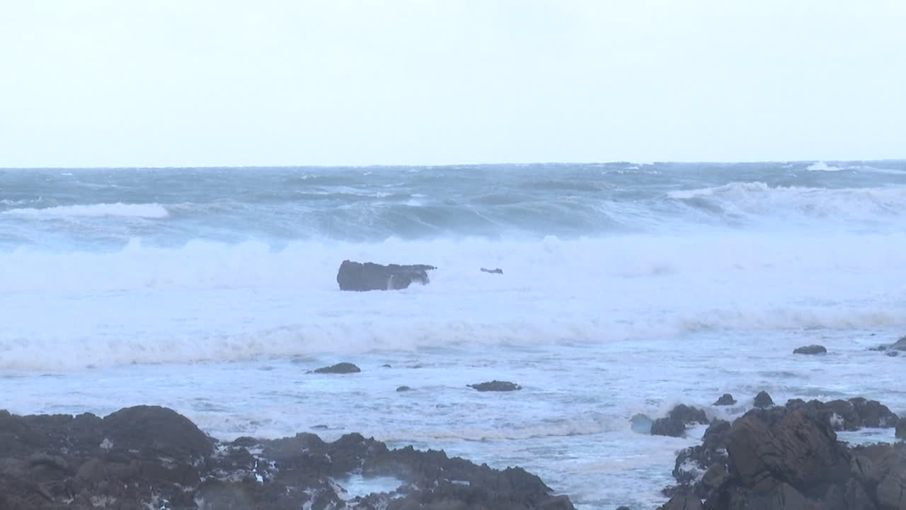 Stormy Ocean Waves Crashing on Rocks