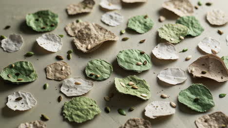 assortment of handmade seed paper pieces with plant seeds