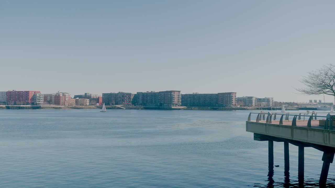 Waterfront Buildings With Fishing Pier In Foreground. Downtown Boston, Massachusetts, USA. wide shot