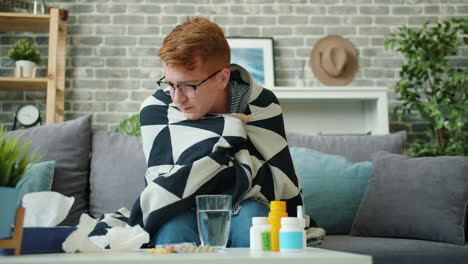 sick man resting on sofa