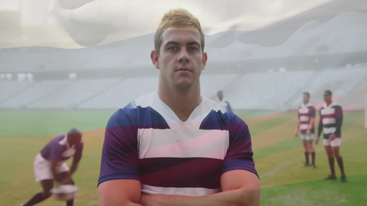 Standing confidently on field, rugby player with teammates in background animation