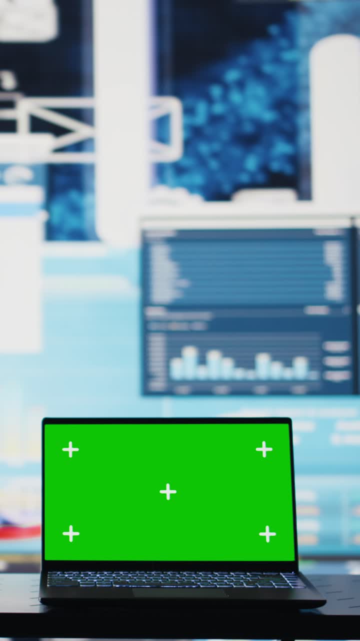 Vertical Video Isolated copy space screen running on laptop next to fintech annual reports
