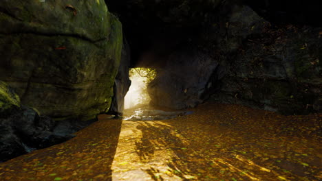 empty road goes through the cave with glowing end