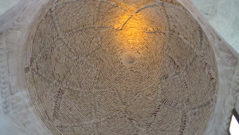 we see the circular dome of the siti radviyye tomb made of red and white stones