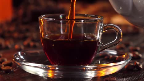 coffee being poured into a glass cup