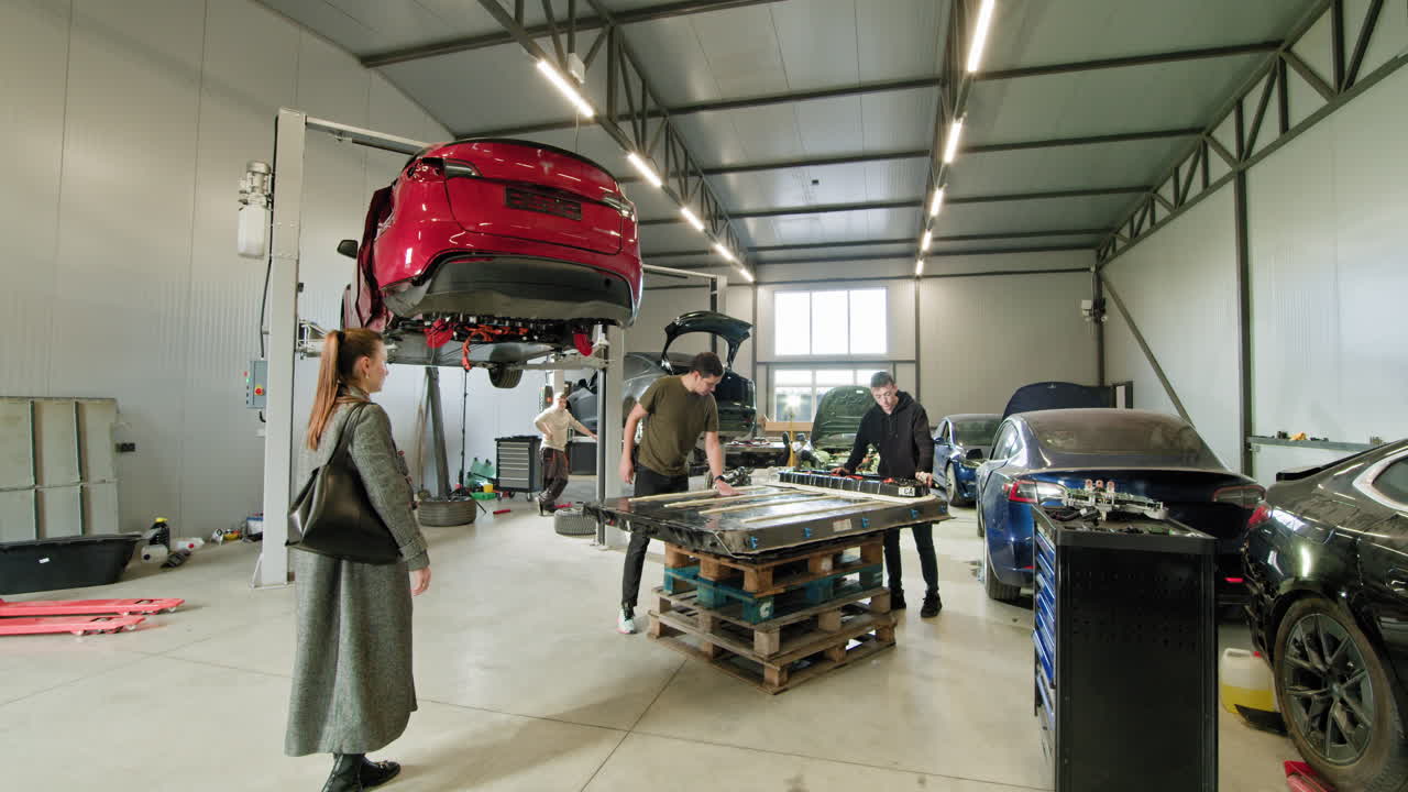 Electric Car Battery Replacement in a Workshop