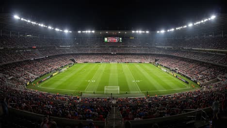 a spectacular evening at the stadium: fans gather under bright lights for an exciting soccer match, capturing the electric atmosphere and anticipation of the game