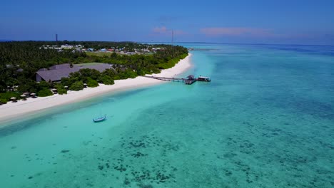 boat arriving to luxury resort in beautiful maldives in the indian ocean