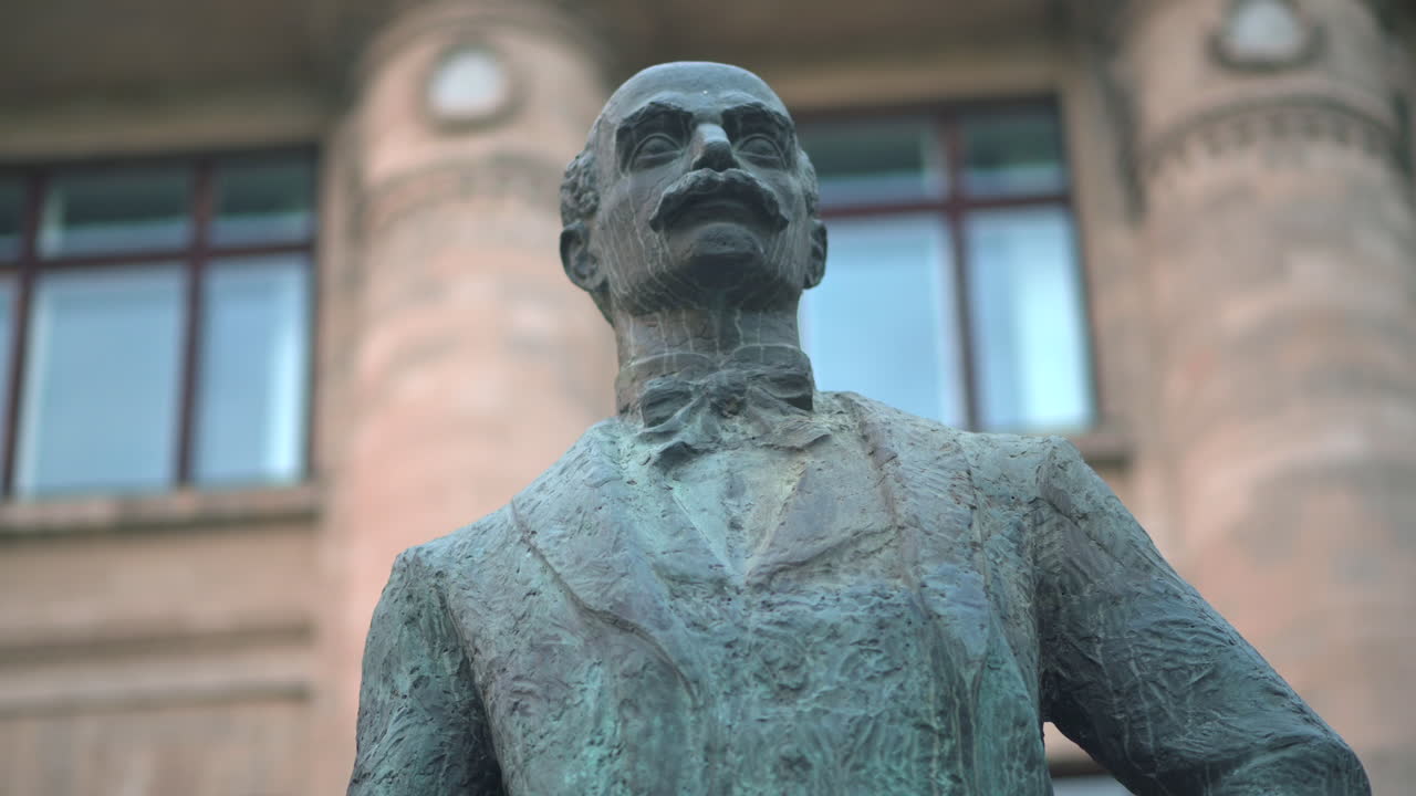Vasile Alecsandri's bronze statue in front of National Library of Moldova in Chisinau