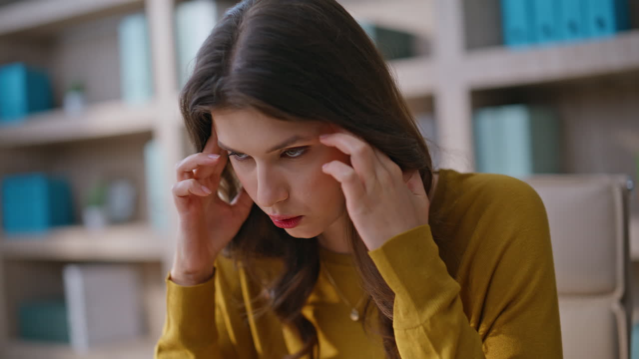 Woman executive yelling cellphone troubled by business failure in office closeup