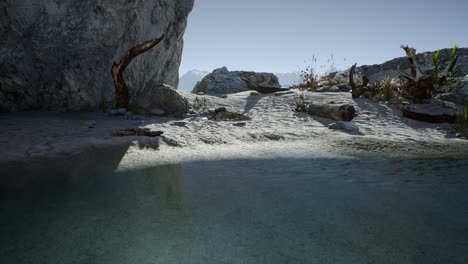 white-sand-beach-near-rocky-cliffs-at-ocean