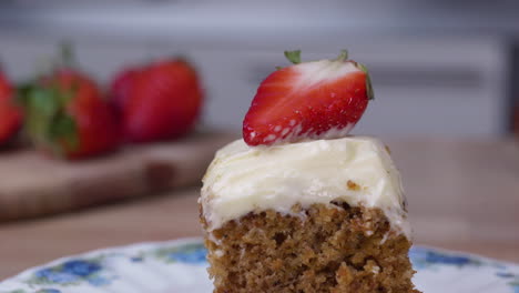 delicious carrot cake topped with a strawberry slice - close up