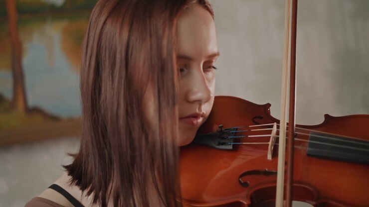 Young violin practice. Concentrated orchestrations in cozy practice room under quiet supervision. Young musician diligently tuning and bowing during private indoor lesson with subtle guidance