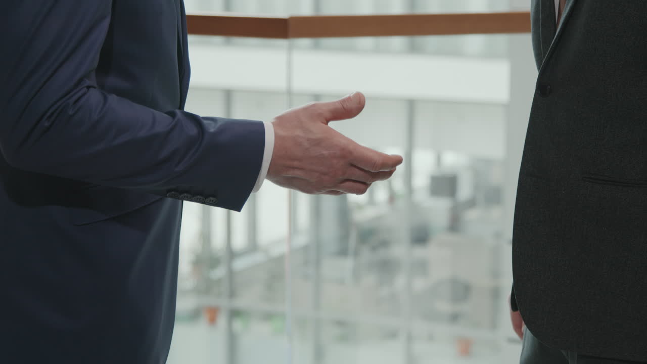 Business Men in Suits Shaking Hands