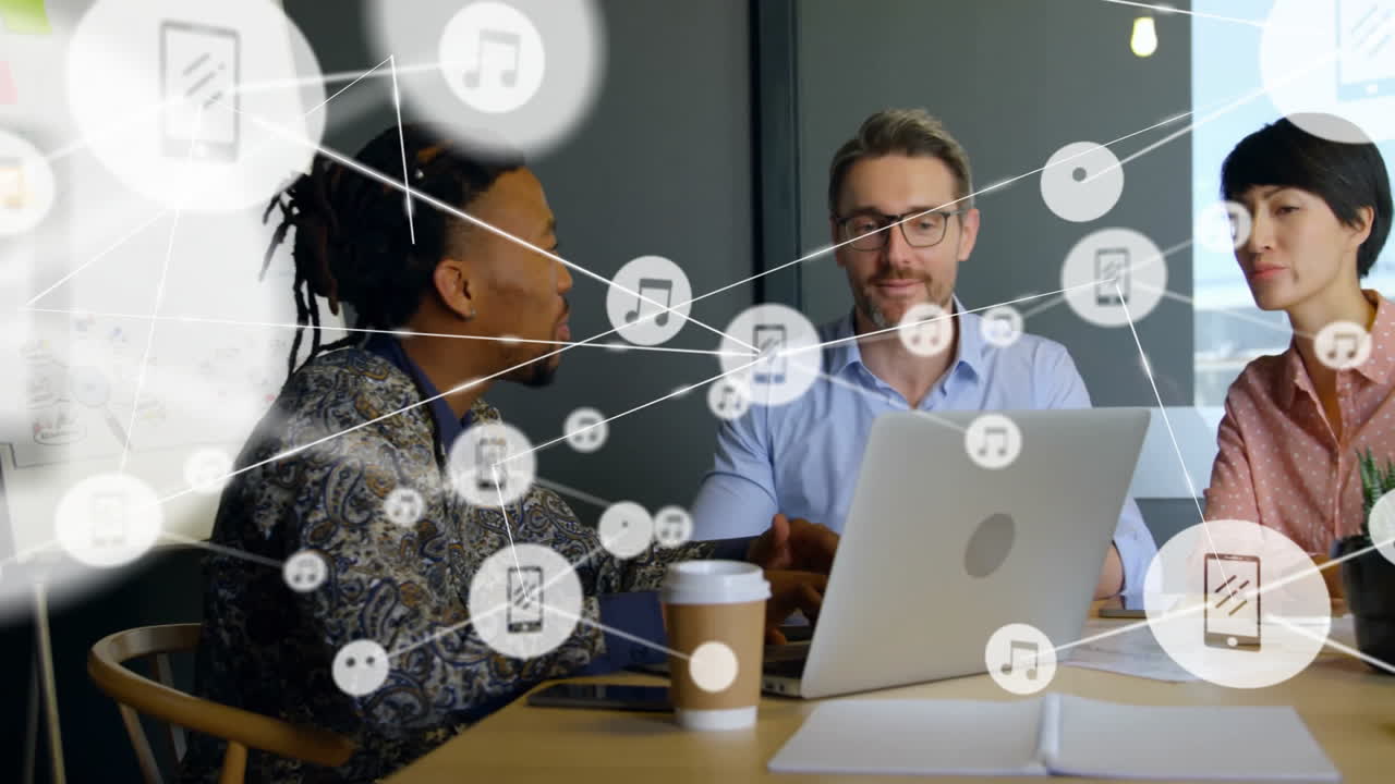 Animation of network of connections with icons over diverse colleagues talking in office