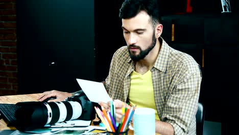 man working with camera