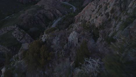 Pulling-backwards-shot-revealing-vast-landscape-high-above-Big-Cottonwood-canyon,-Utah