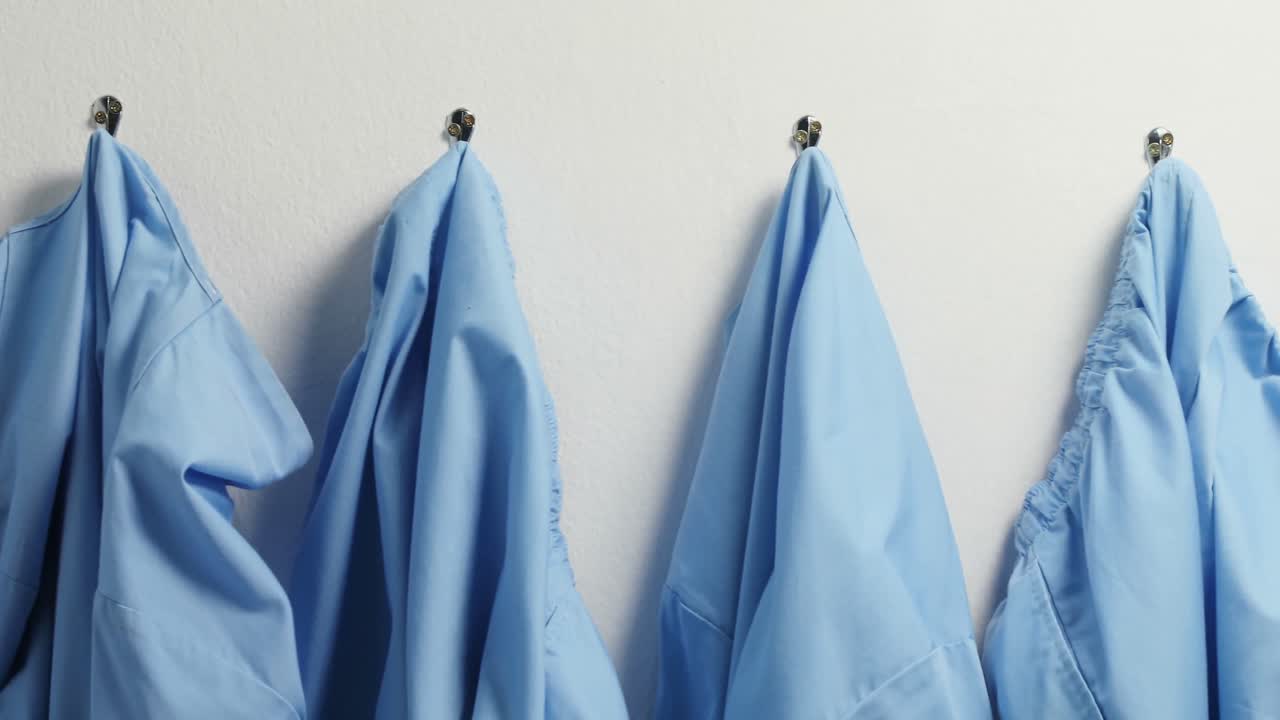 Scrubs hanging on hook 4k