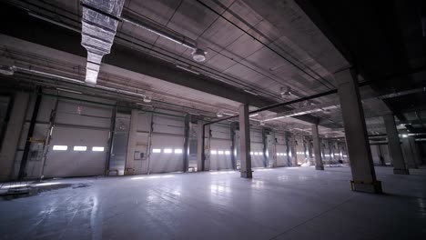 big and modern warehouse under construction, featuring metal shelving and other industrial equipment.