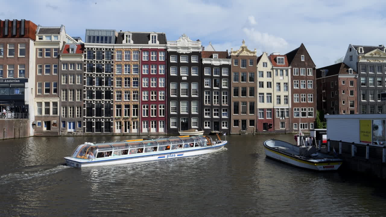 Navigating Amsterdam's Canals and nice buildings: A Relaxing Cruise