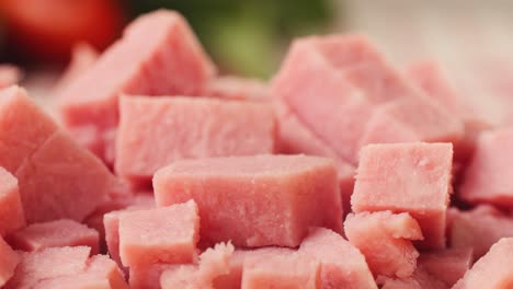 ham italian mordatella, man slices of traditional italian antipasti mortadella sausage on a wooden cutting board, close up macro of chicken or turkey jamon, fat breakfast dish.
