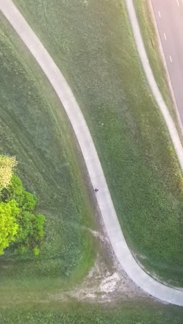 aerial view of a walking path through a grassy landscape