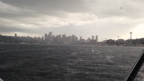 downtown seattle, wa from lake union during heavy rain downpour