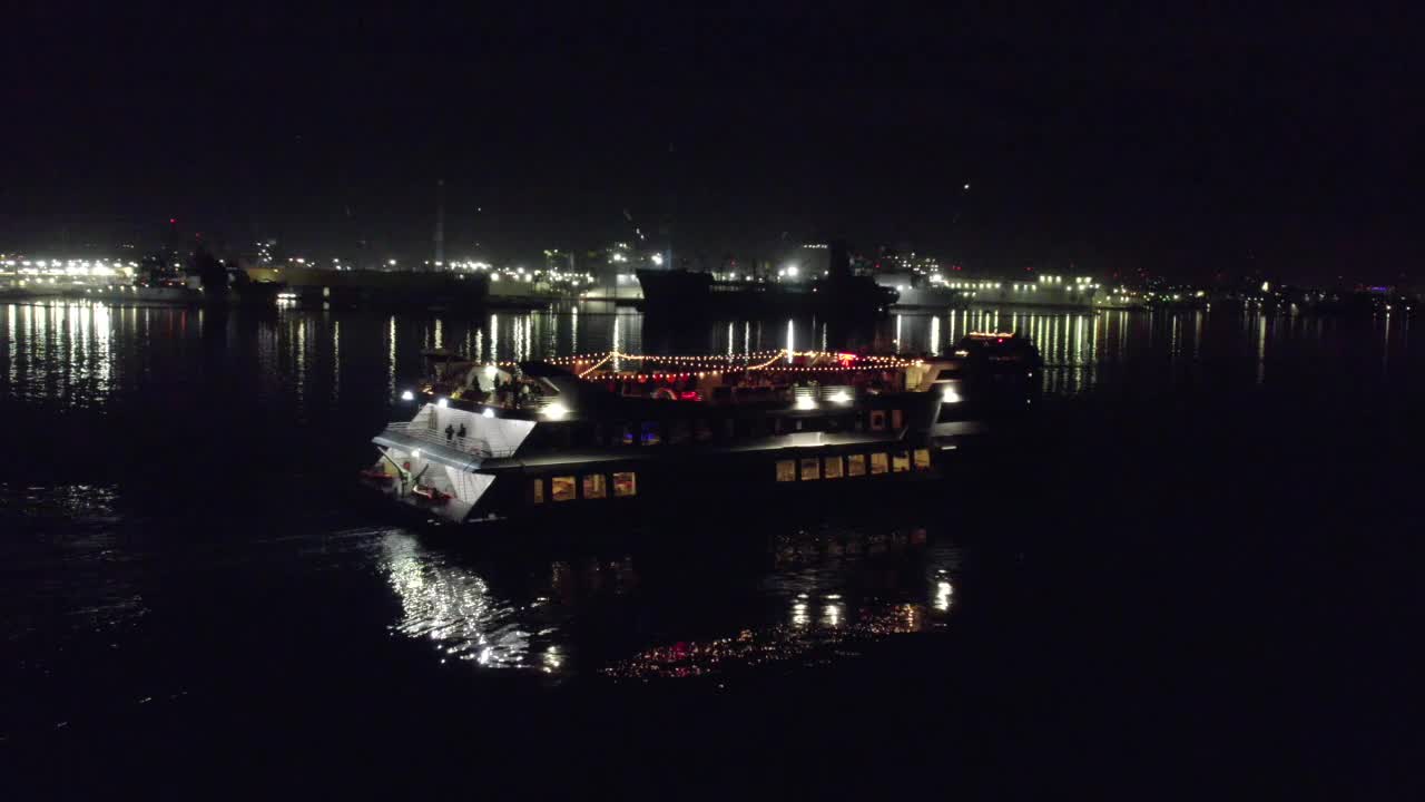 Angle or Movement 4 (Orbit Shot): Night-time drone shots of a ship cruising Misson Bay in San Diego, California. Shot is 4k 60fps and can be slowed down.