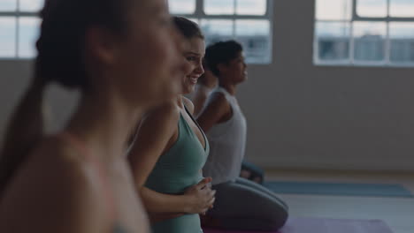 yoga-class-beautiful-women-friends-chatting-preparing-for-ealy-morning-workout-getting-ready-in-fitness-studio-at-sunrise