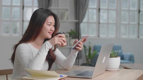 Asian Girl Drinking Coffee While Use Phone, Video In 4K