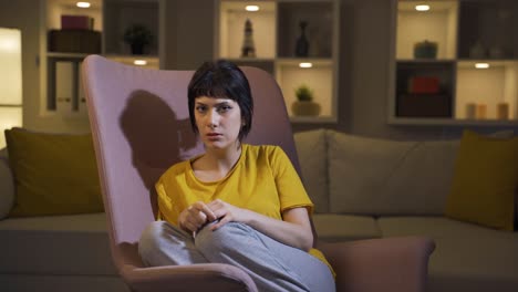 young woman looking at camera with cowardly eyes.