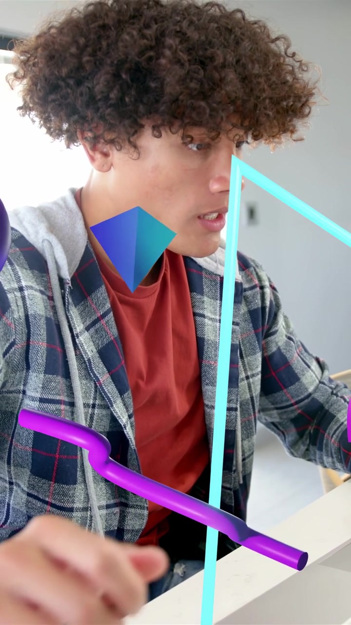 Vertical video: Man lowering mug looking at laptop and typing for IT while AR helix moving on torso