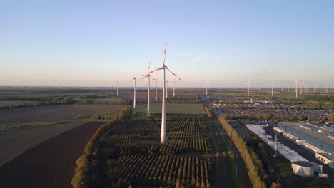 dramatic aerial view flight speed ramp hyperlapse motionlapse timelapse
of a wind farm wheel field at brandenburg germany at summer day 2022