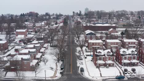 Aerial-of-urban-city-homes-covered-in-winter-snow